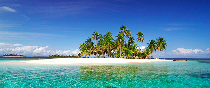 island in san blas with palm trees and white sand beach